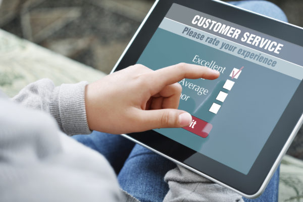 Online customer service satisfaction survey on a digital tablet